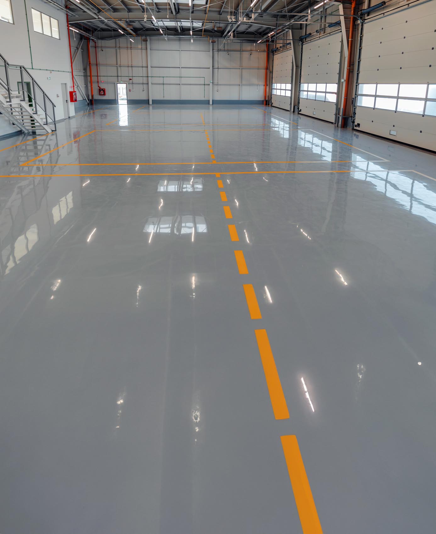 a large industrial warehouse with epoxant paint all over the floors